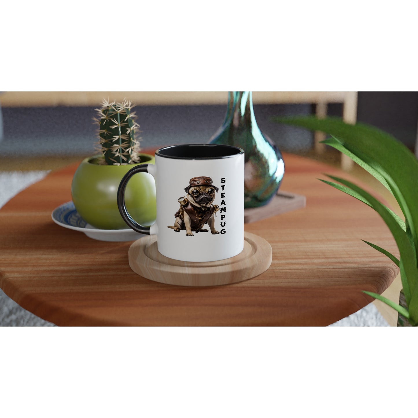 round wooden end table with a potted cactus, glass vase, and white mug on it. The mug has a black handle, rim, and interior and has a picture of a pug dressed in a steampunk-style outfit, goggles, and hat with the word "Steampug" written down the right side of the image.