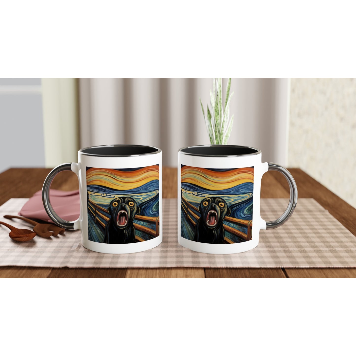 Two white mugs on a gray-checkered placemat on a kitchen table. The handle of one mug is to the left, the other handle is to the right, showing the front and back of the mug. The mugs have with black handles, rims, and insides. The print is the same on both mugs: a pug version of Edvard Munch's "The Scream"