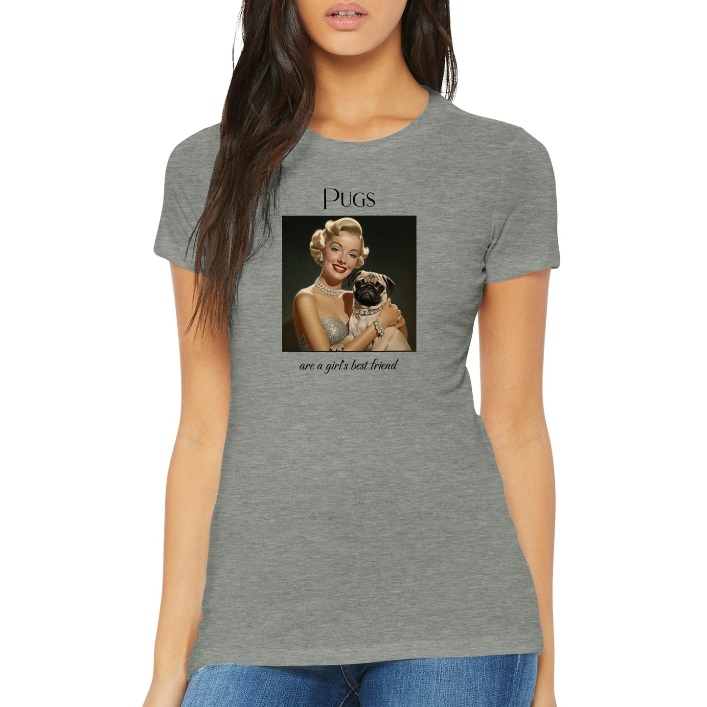 Young woman wearing an athletic heather gray t-shirt with Image of Marilyn Monroe wearing a chunky diamond necklace and bracelet and holding a fawn-colored pug who is wearing a matching diamond collar. The word "Pugs" is above the image and the words "are a girl's best friend" are under the image.