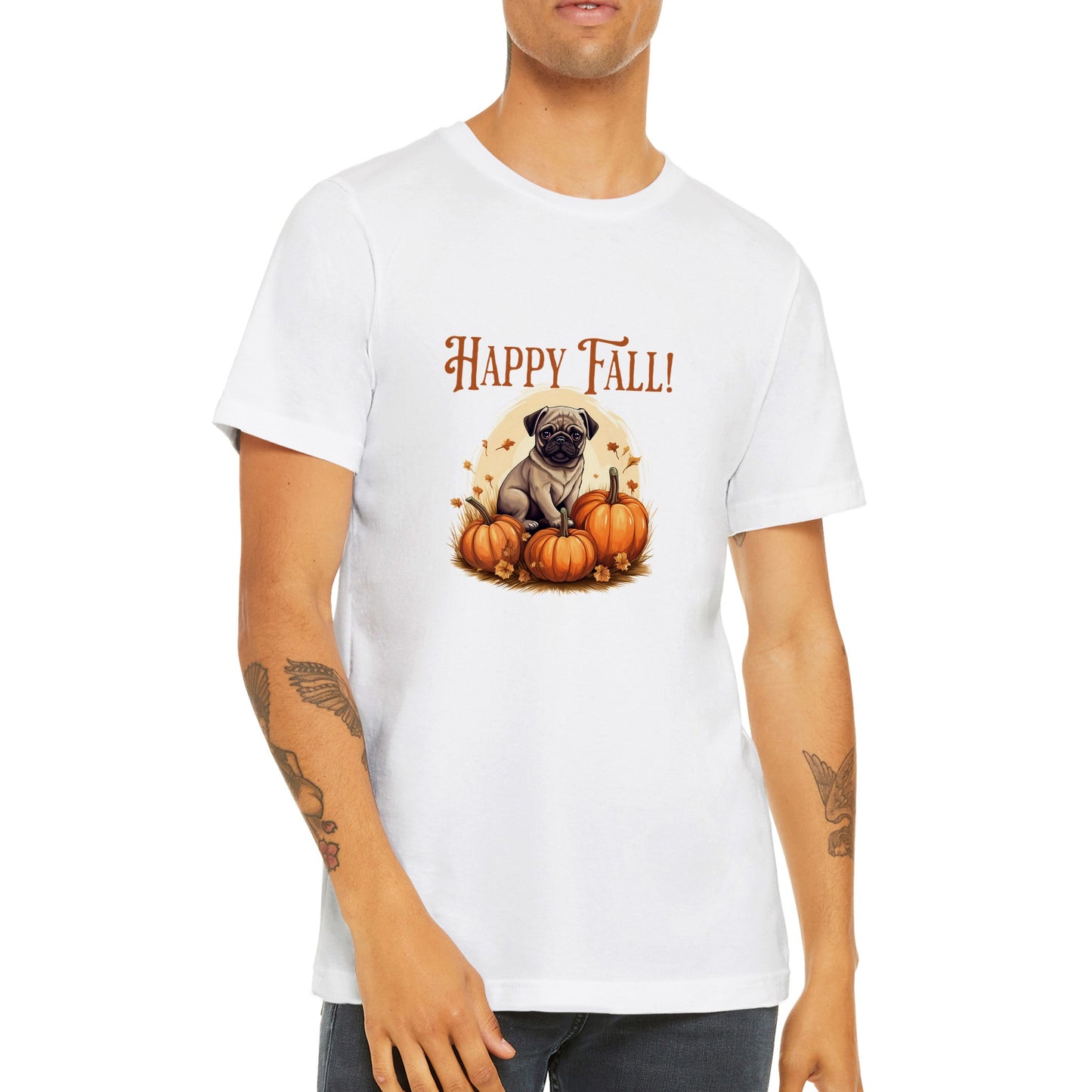 Young man wearing a white t-shirt with a picture of a pug sitting in a pumpkin patch