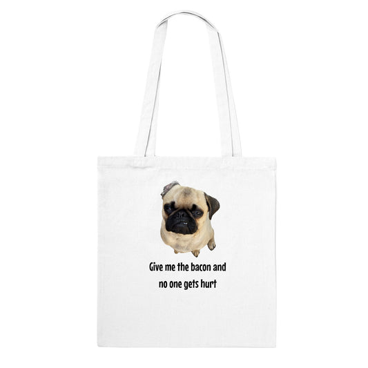 White tote bag with a picture of a fawn-colored pug doing a lip curl and the words "Give me the bacon and no one gets hurt" under it