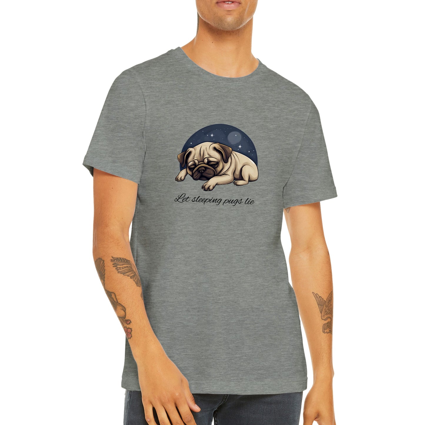 Torso of a young man wearing an athletic heather gray t-shirt with a cartoonish picture of a sleeping pug surrounded by a half-circle of starry night sky with the words "Let sleeping pugs lie" under the image in cursive lettering.