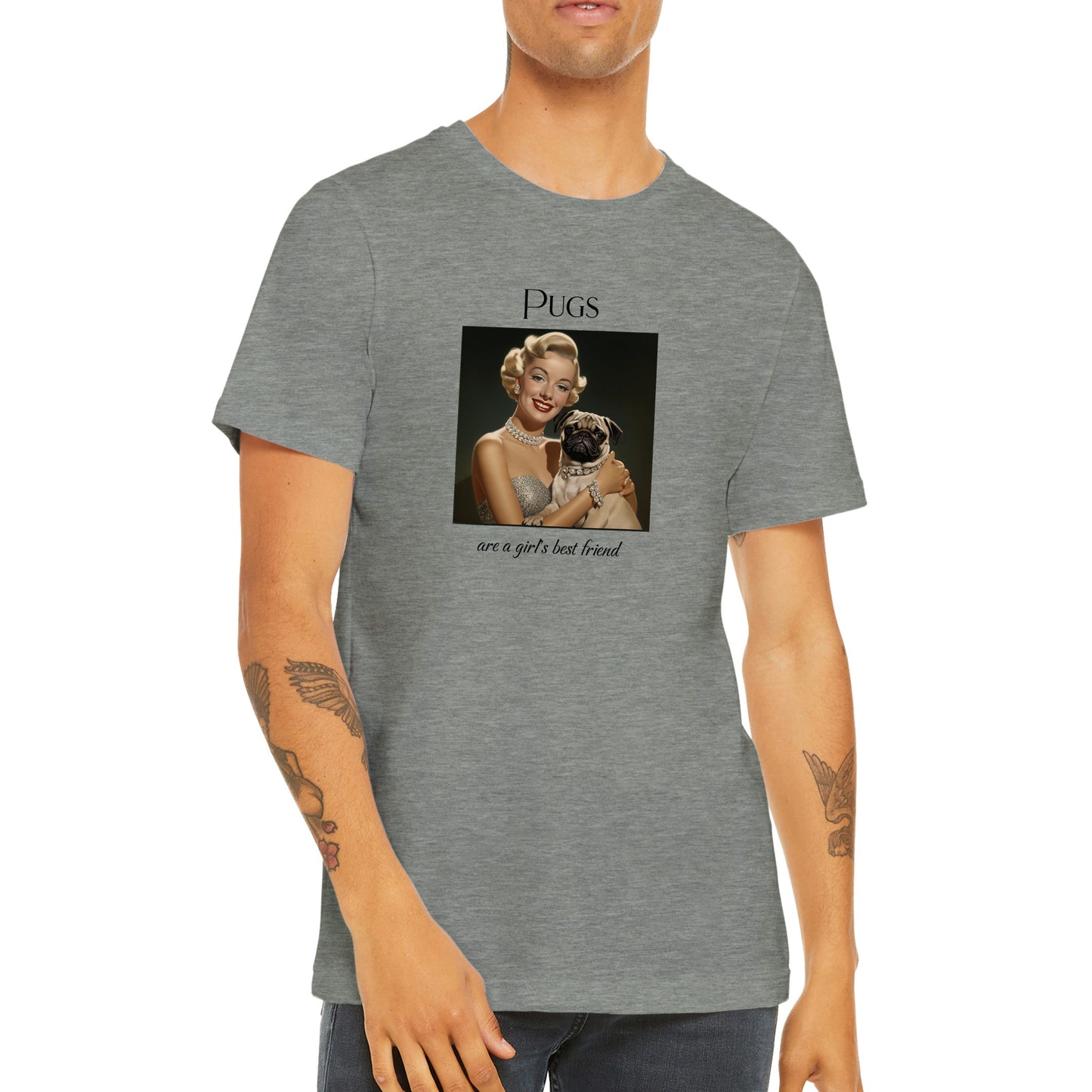 Torso of a young man wearing an athletic heather gray t-shirt with Image of Marilyn Monroe wearing a chunky diamond necklace and bracelet and holding a fawn-colored pug who is wearing a matching diamond collar. The word "Pugs" is above the image and the words "are a girl's best friend" are under the image.