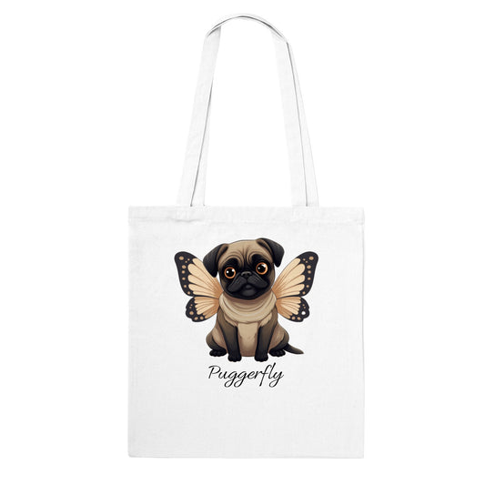 White tote bag with a cartoon style picture of a fawn-colored pug with orangey-beige butterfly wings attached to her back and big sad eyes. The word "Puggerfly" is beneath the image.