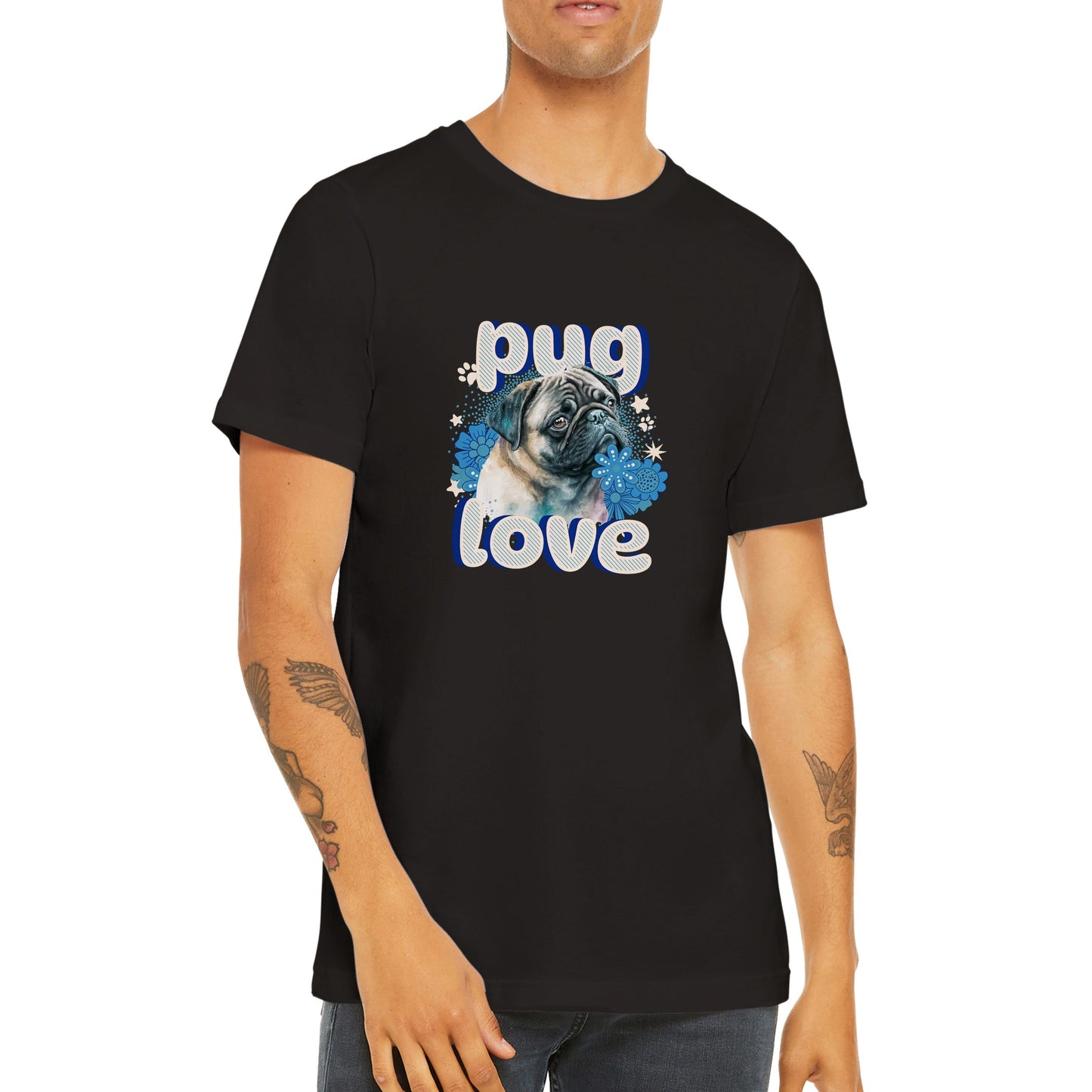 Torso of a young man wearing a black t-shirt with a pug's head and shoulders surrounded by blue flowers and white stars and paw prints with the word "pug" above and the word "love" below in puffy bubble letters.