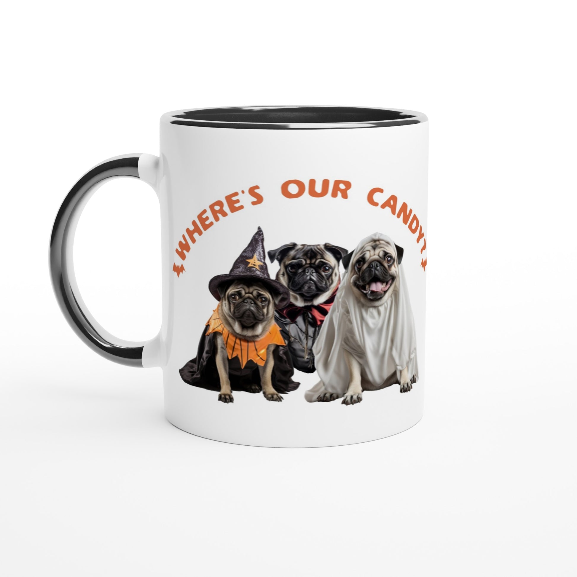 White mug with black handle, rim, and inside  with a picture of three pugs--one dressed as a witch, one dressed as a vampire, and one dressed as a ghost with the words "Where's our candy?" arched over them.