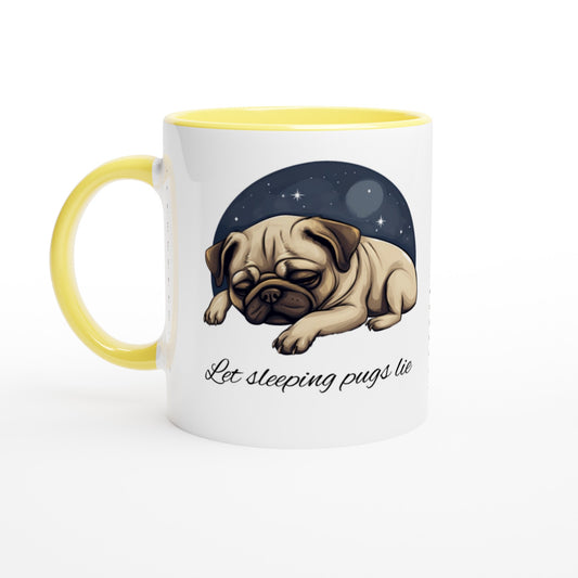 White mug with yellow handle, rim, and inside with a cartoonish picture of a sleeping pug surrounded by a half-circle of starry night sky with the words "Let sleeping pugs lie" under the image in cursive lettering.