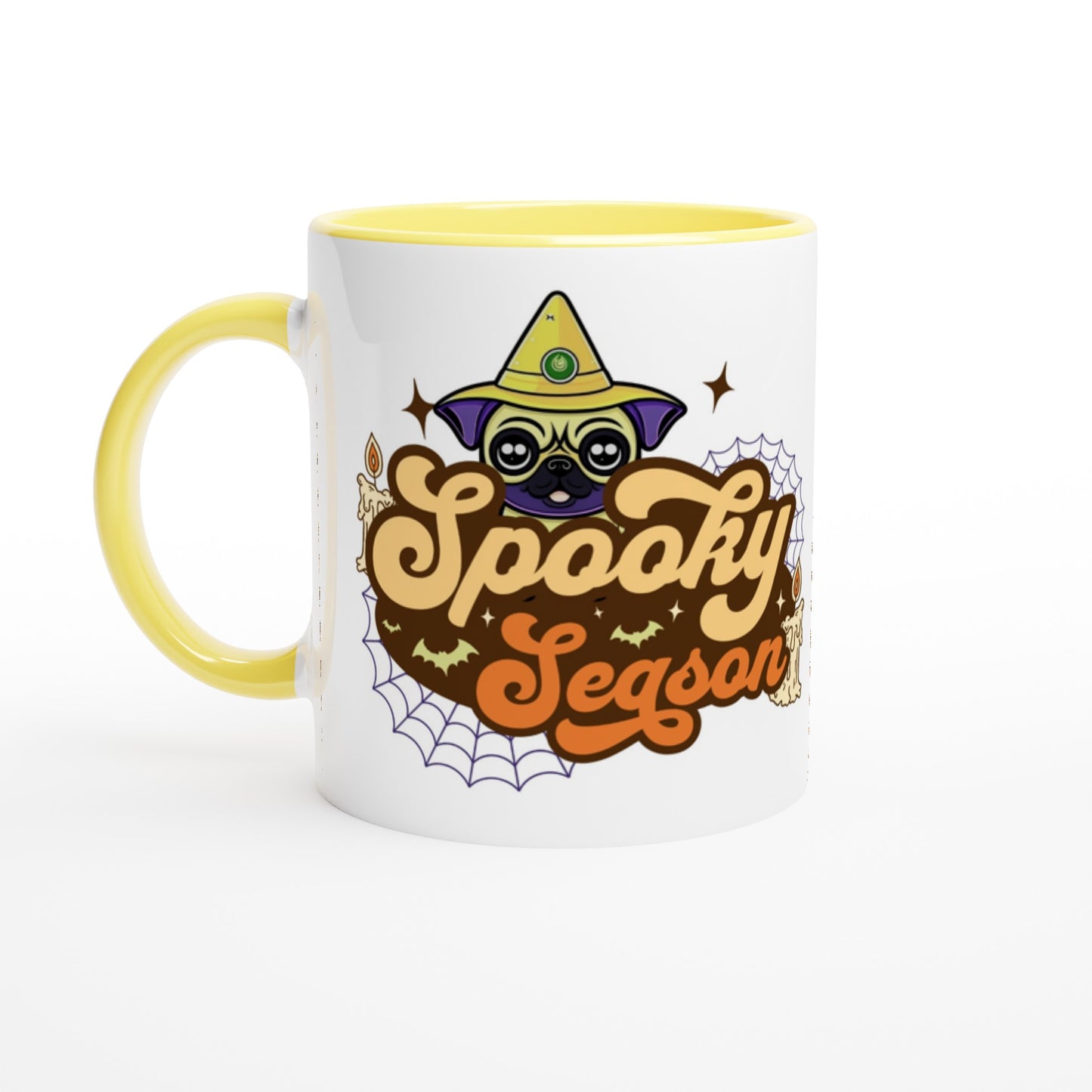 White mug with yellow handle, rim, and inside with the image of a pug's head in a witch's hat and the words "Spooky Season" below it. The image also has cobwebs, bats, and candles in it.