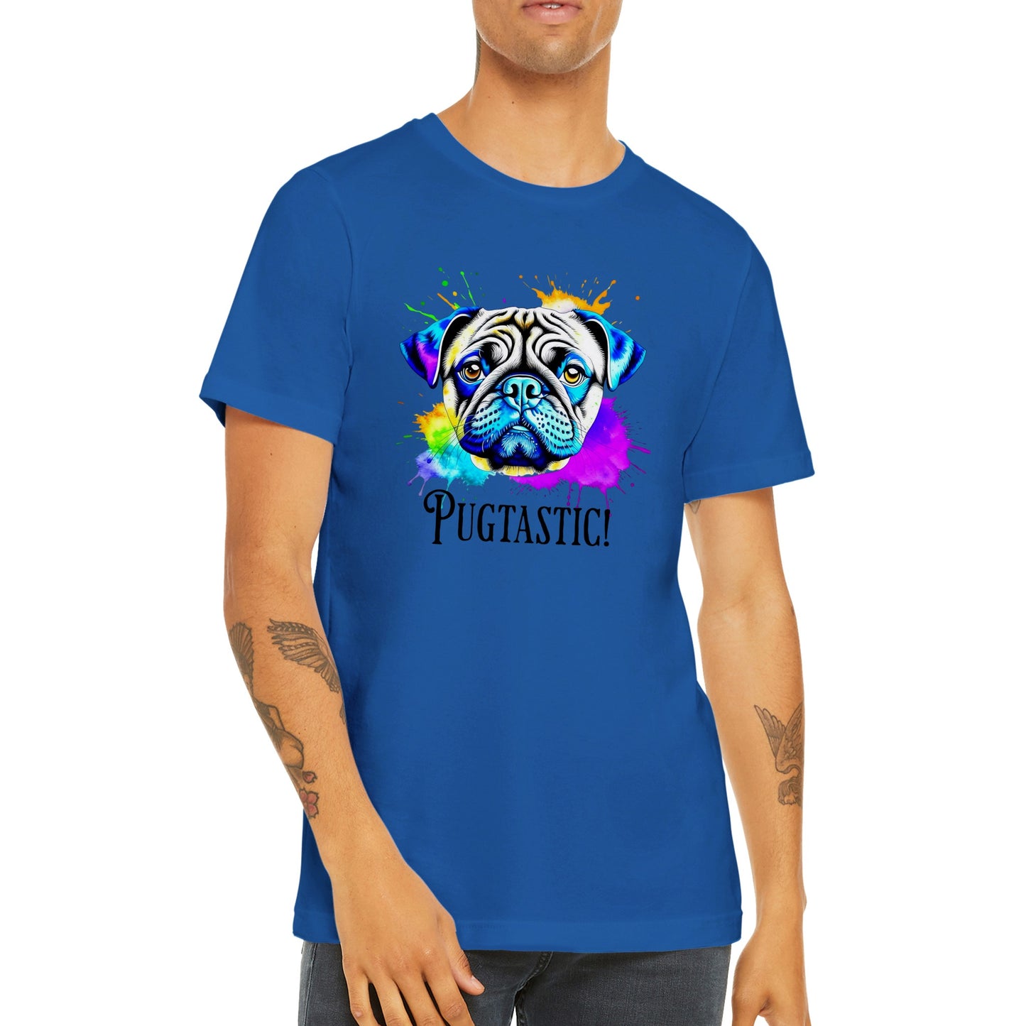 Torso of a young man wearing a royal blue t-shirt with the image of a pug done in blues, beige,  and  purple with splotches of orange, yellow, green , blue, and purple around it.  The word "Pugtastic!" is written beneath the image in all caps.