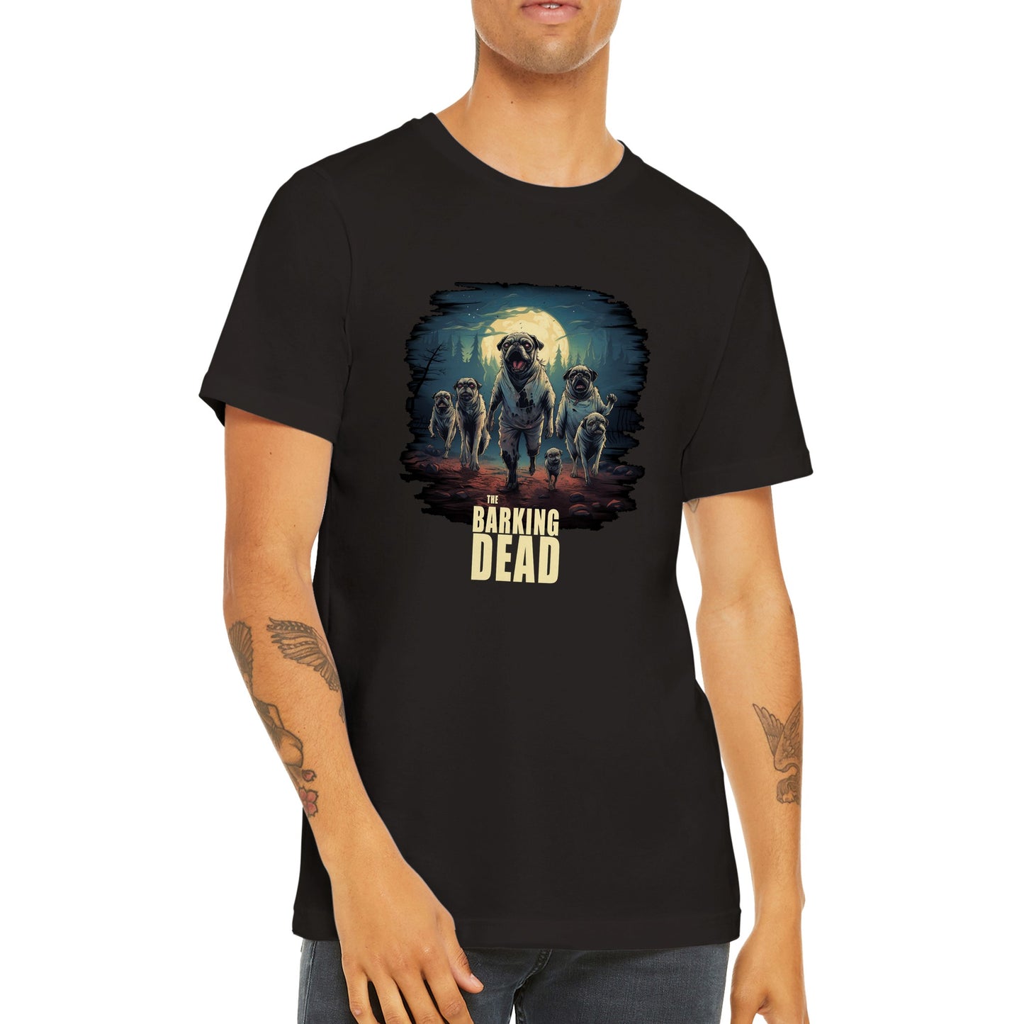 Torso of a young man wearing a black t-shirt with the image of a group of zombie pugs walking through a forest on a spooky moonlit night with the words "The barking dead" underneath the image