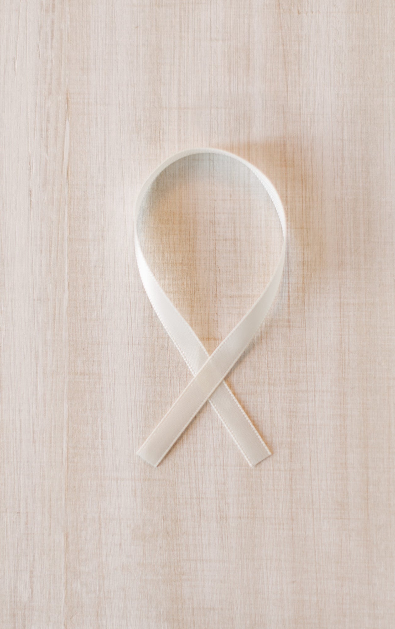 White ribbon for hanging ornament.